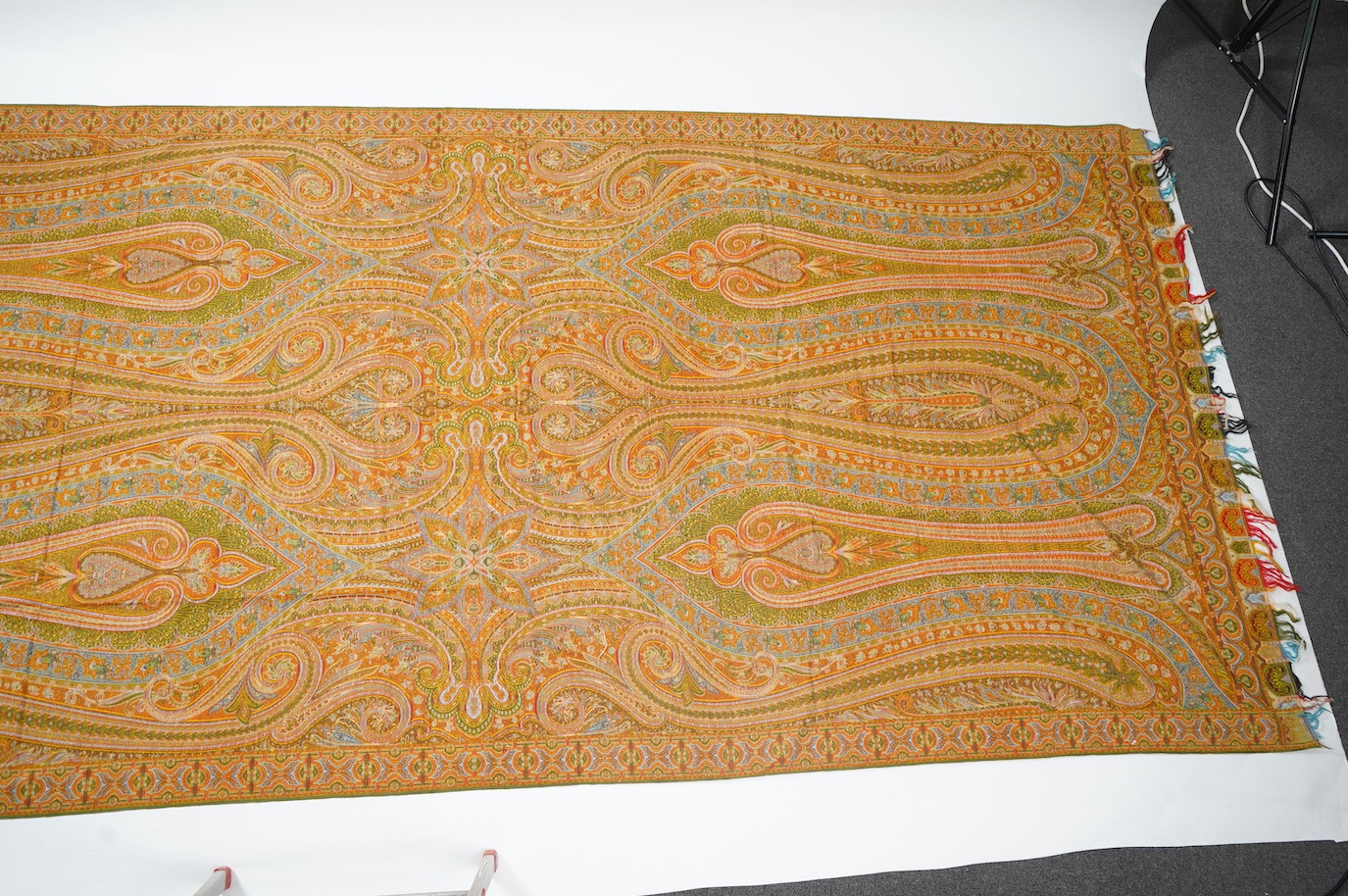 A French possibly Lyon, 19th century ornate silk and fine wool woven Paisley patterned shawl. Woven in polychromes coloured silks and wools on a jacquard loom, using an array of punch cards to create this elaborate desig